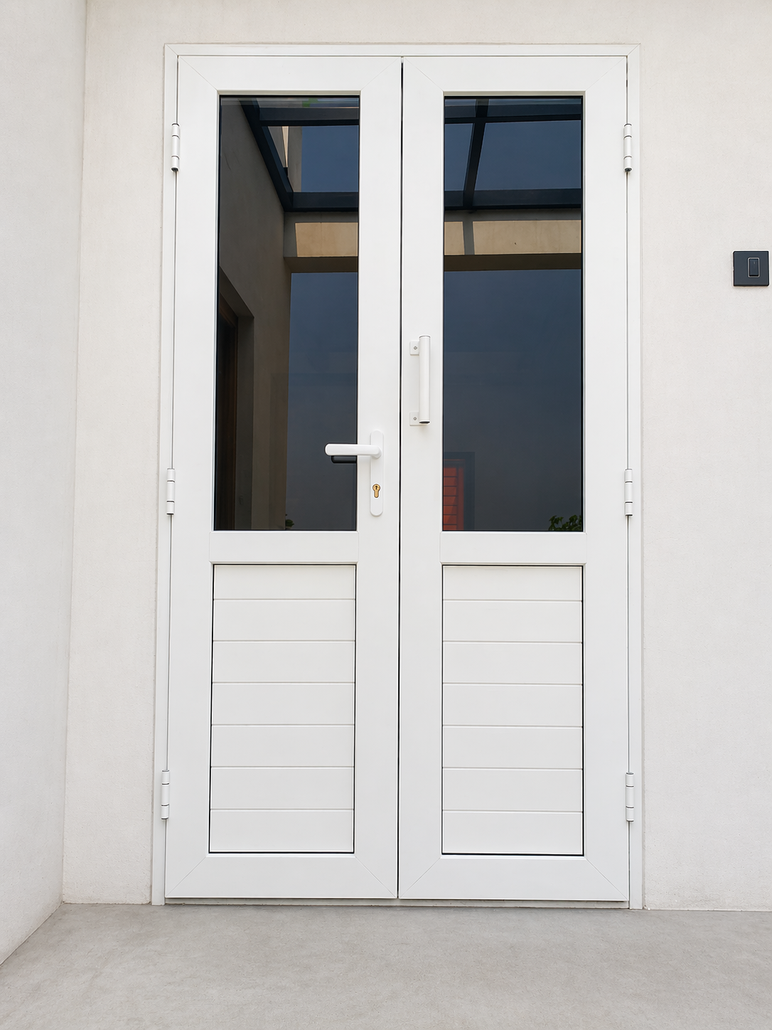 uPVC casement doors installed in a residential project in Coimbatore, Tamil Nadu — strong hinged uPVC door design with excellent weather sealing for main entrances